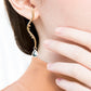 Sinuous earrings with blue tourmaline